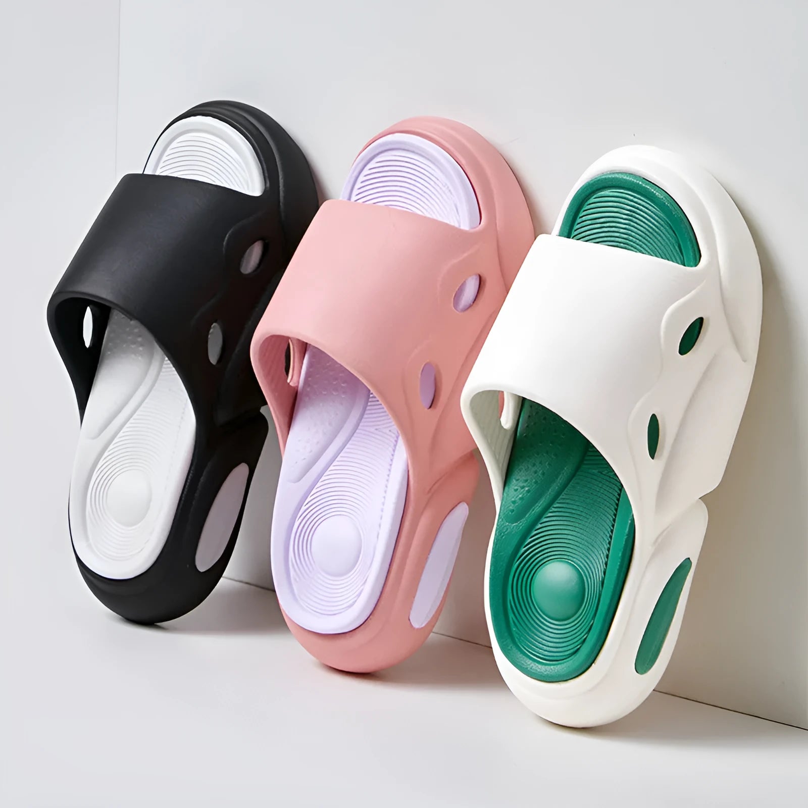 Pink purple and white green two-colour unisex slippers with thick EVA sole and leather lining.