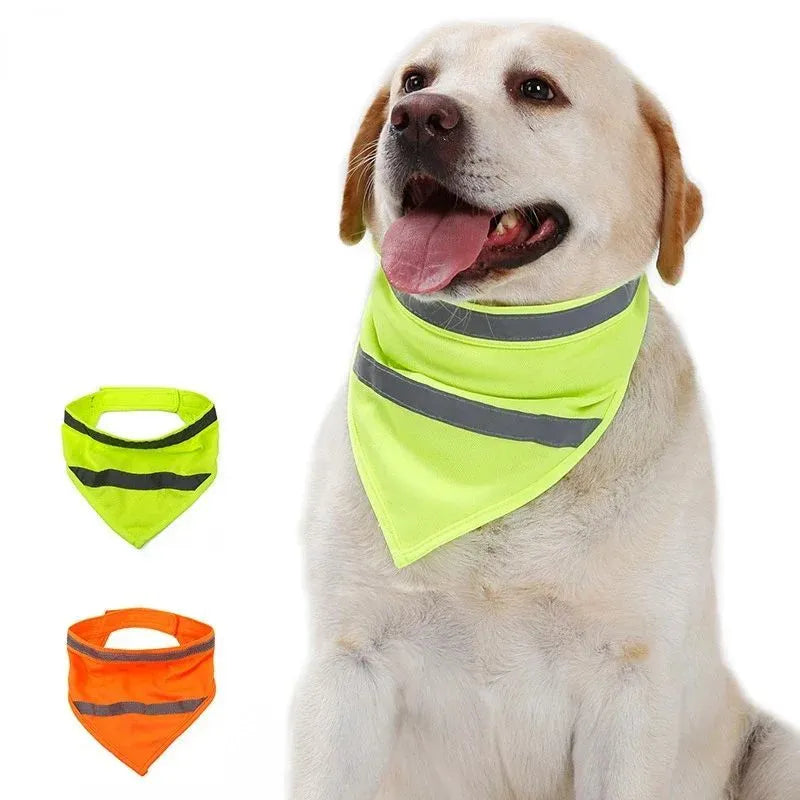 Yellow and orange polyester dog bandana with reflective stripes laid flat, showing adhesive strap closure.