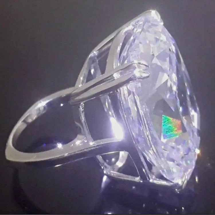 Women's white gold colour geometric ring with inlaid square diamond design on finger