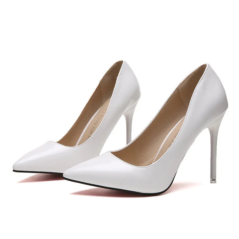 Women's pointed toe stiletto heel pump in apricot colour with a buckle detail on a rubber sole.
