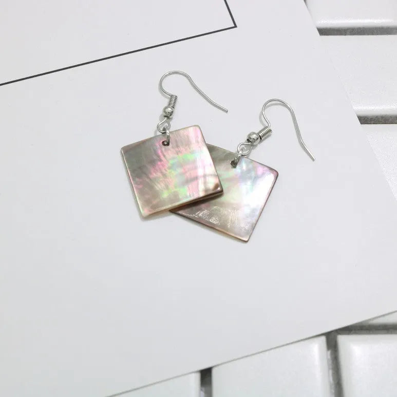 Women's shell geometric earrings with rectangular and square panther designs in natural shell material