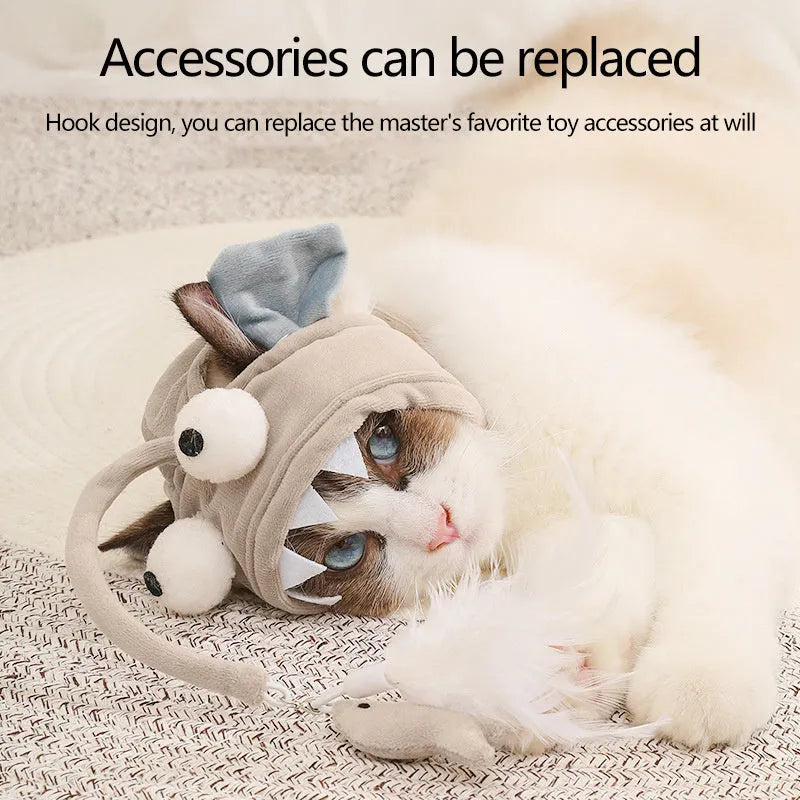 Grey cat teaser toy with adjustable headband, feather decoration, and big eye fish design