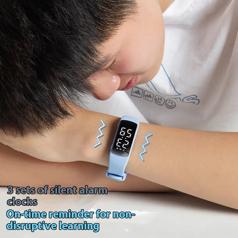Smart electronic watch with colour options on a silicone strap, showing its LED display and slim profile.