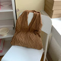 Retro hollow knitted women's shoulder tote bag in a solid colour with double straps.