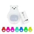 White cartoon bear silicone night light with remote control on a surface.