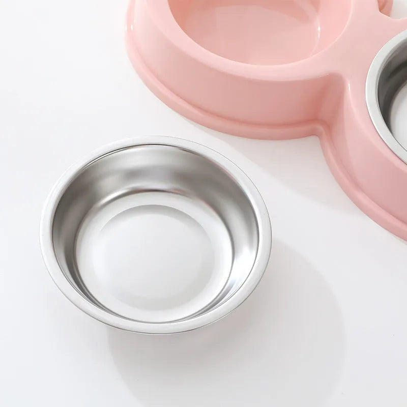 Stainless steel pet double bowl with frog design for cat and dog food and water.