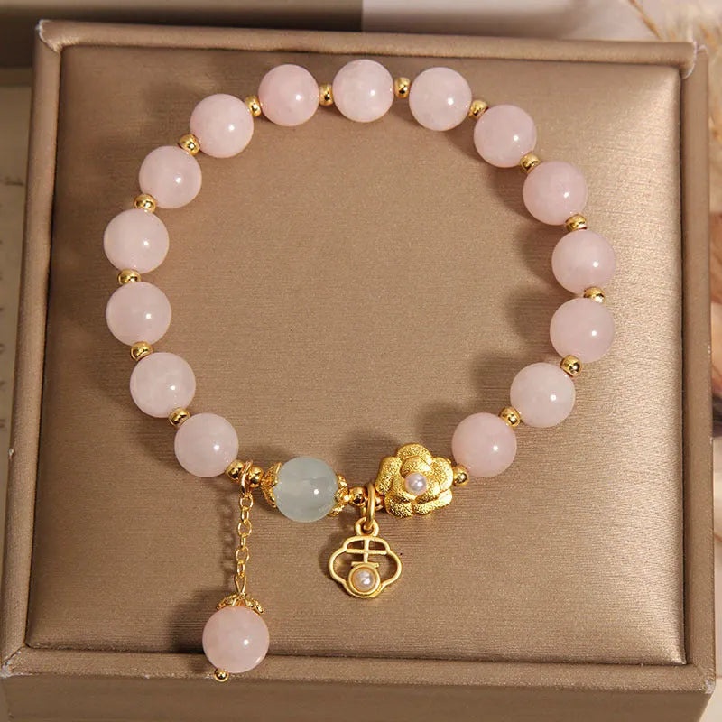Women's pink crystal flower bracelet with refined graceful design on wrist