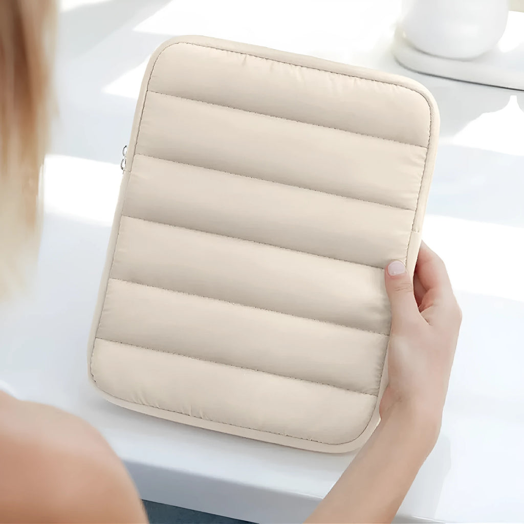 Fluffy air feeling laptop sleeve with elastic sides for 9.7 to 11 inch devices in black, khaki, or silver.