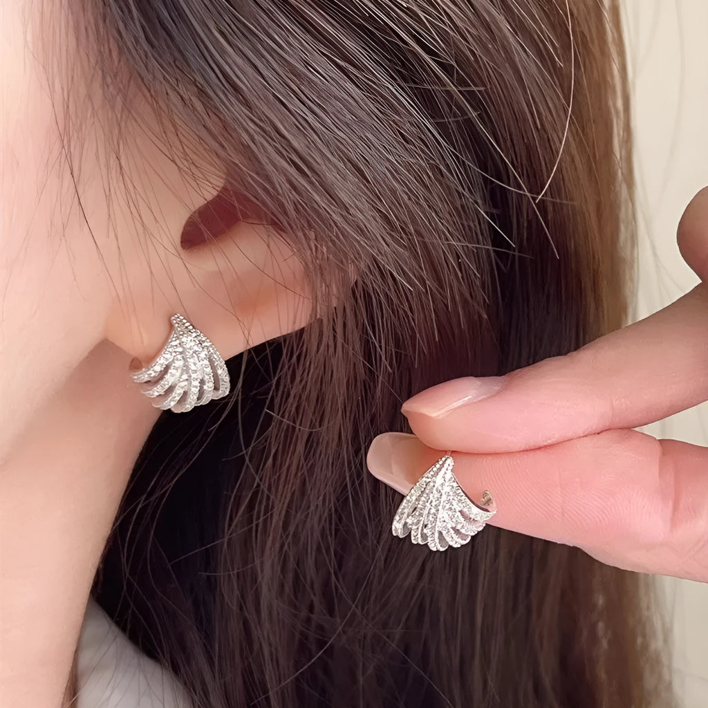 A pair of women's geometric line design earrings in platinum-finished zircon.