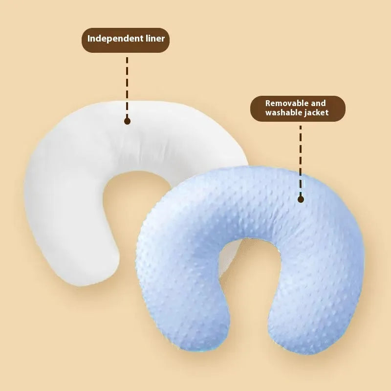 Grey nursing pillow with raised spill guard edge on a white background.