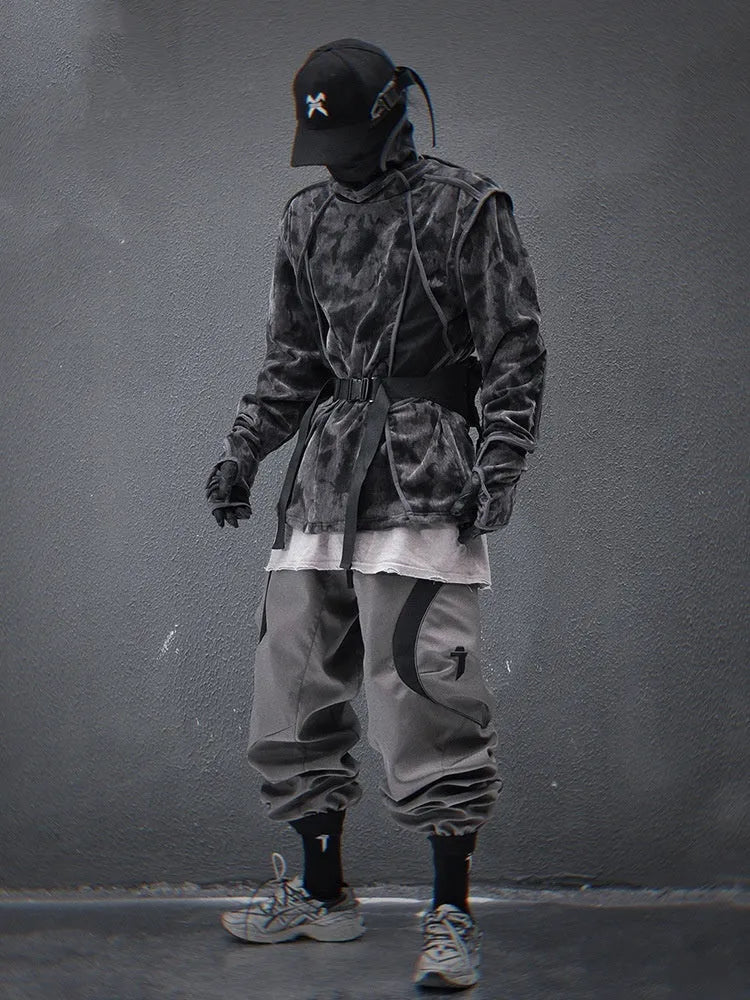 Man modelling a black and grey tie dye print loose fit pullover sweater with drop shoulders.