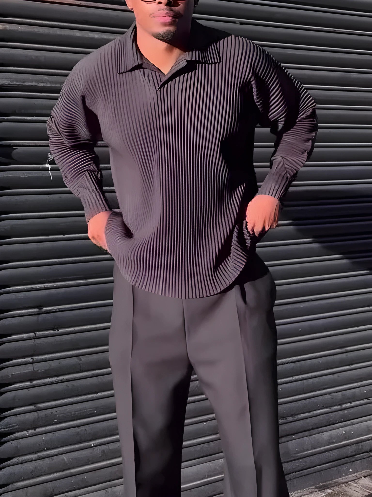 Men's black long-sleeved casual top with a pleated detail on the front.