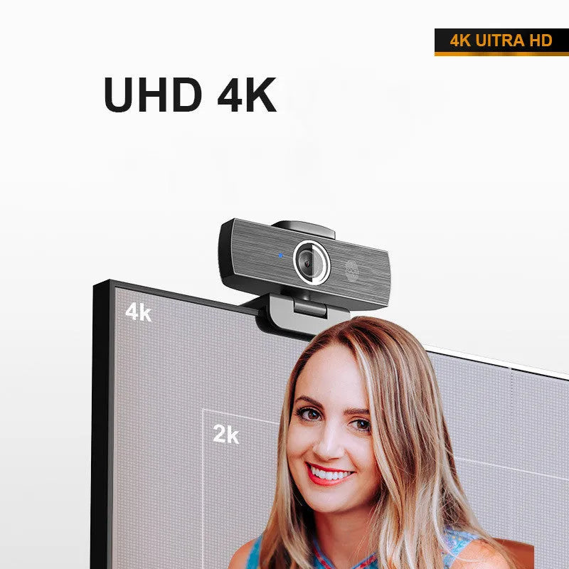 Black 4K USB webcam with magnetic privacy cover on a laptop screen