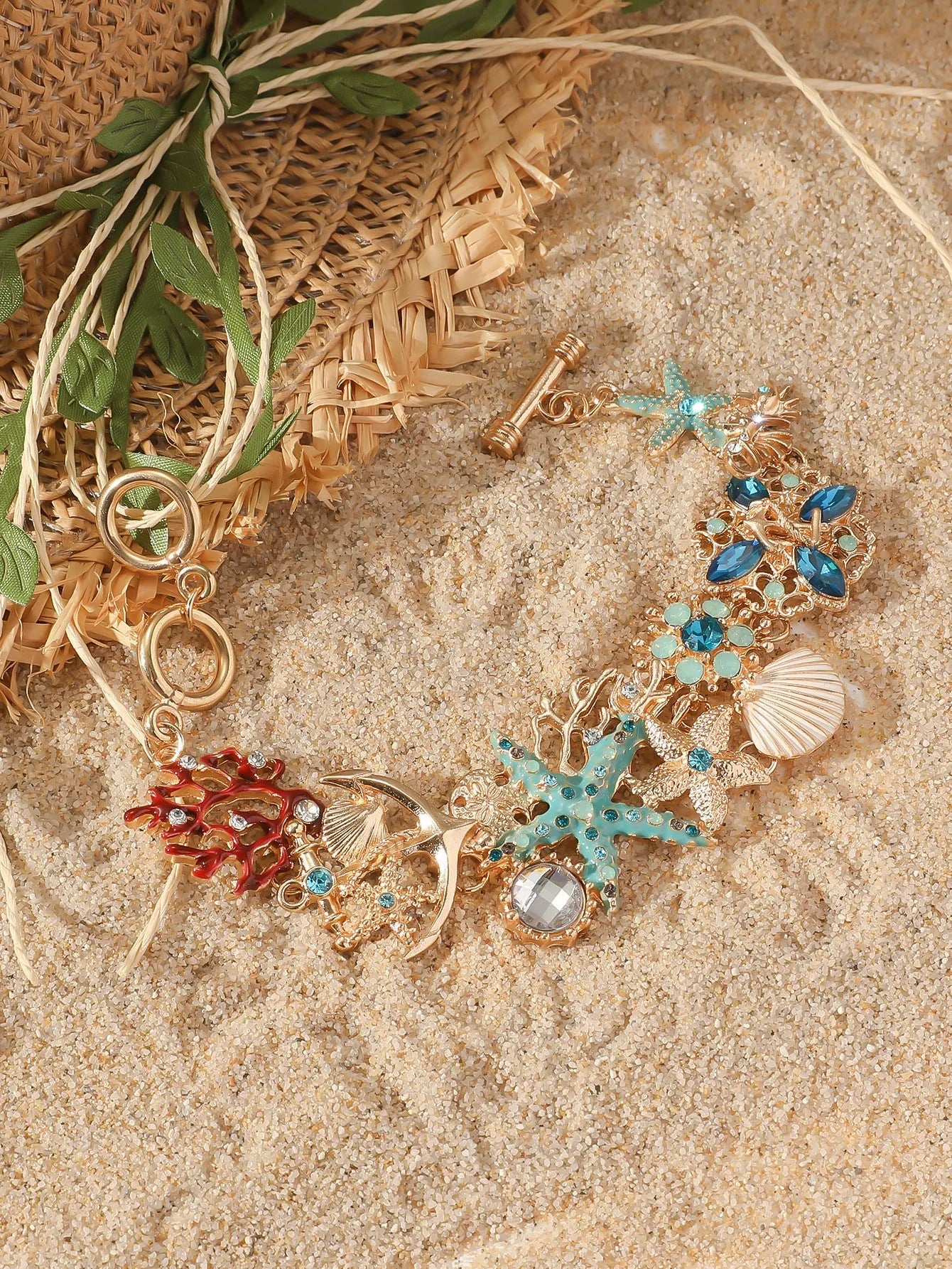 Alloy marine-themed bracelet with anchor and starfish charms in blue colour