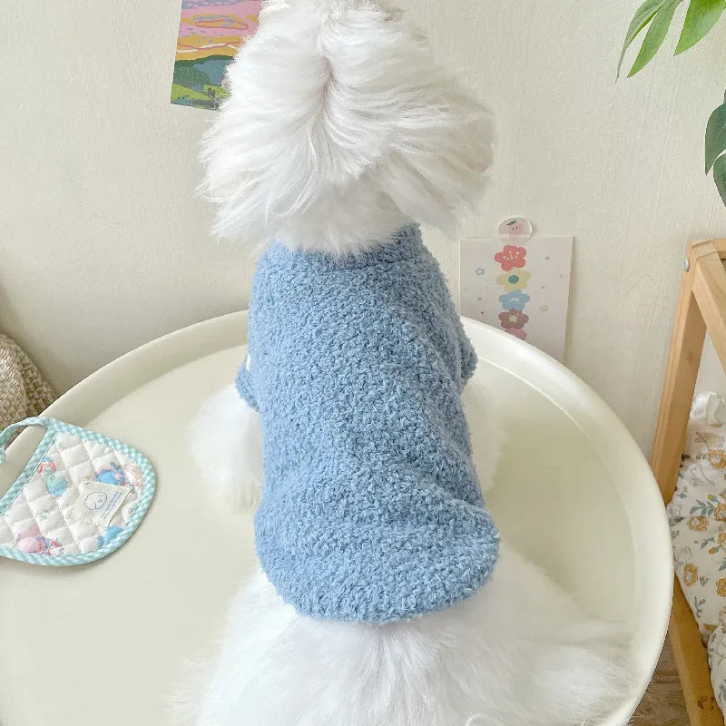 Reversible brown cloud velvet dog jacket shown on a small dog, illustrating the fluffy texture and fit.