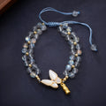 Handwoven women's bracelet with grey moonstone butterfly centrepiece on geometric design