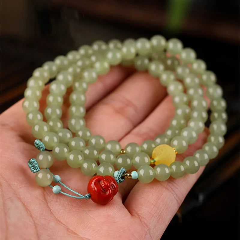Pale blue hetian jade bracelet with 6mm beads in a three-circle hand-stringed design for women