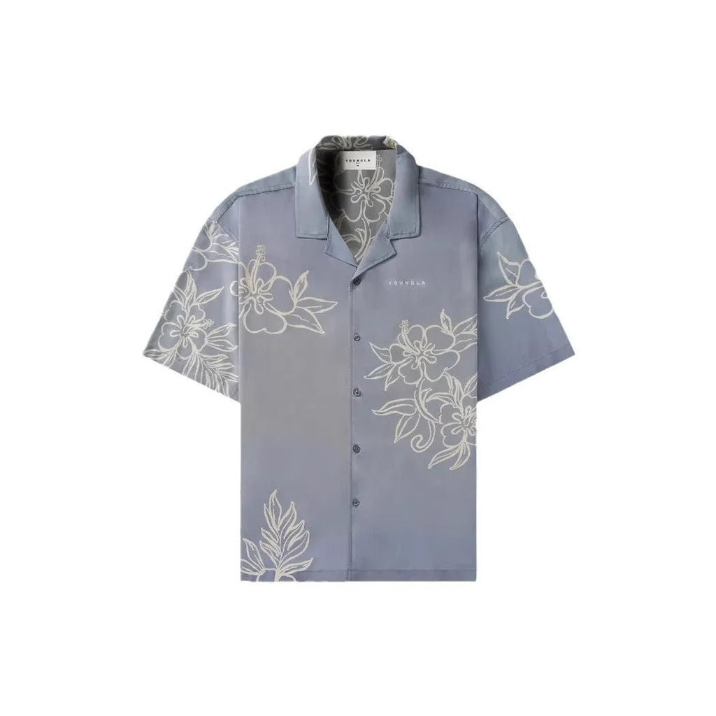 A loose-fitting short sleeve casual top with a floral print, shown in a light colour on a male model.