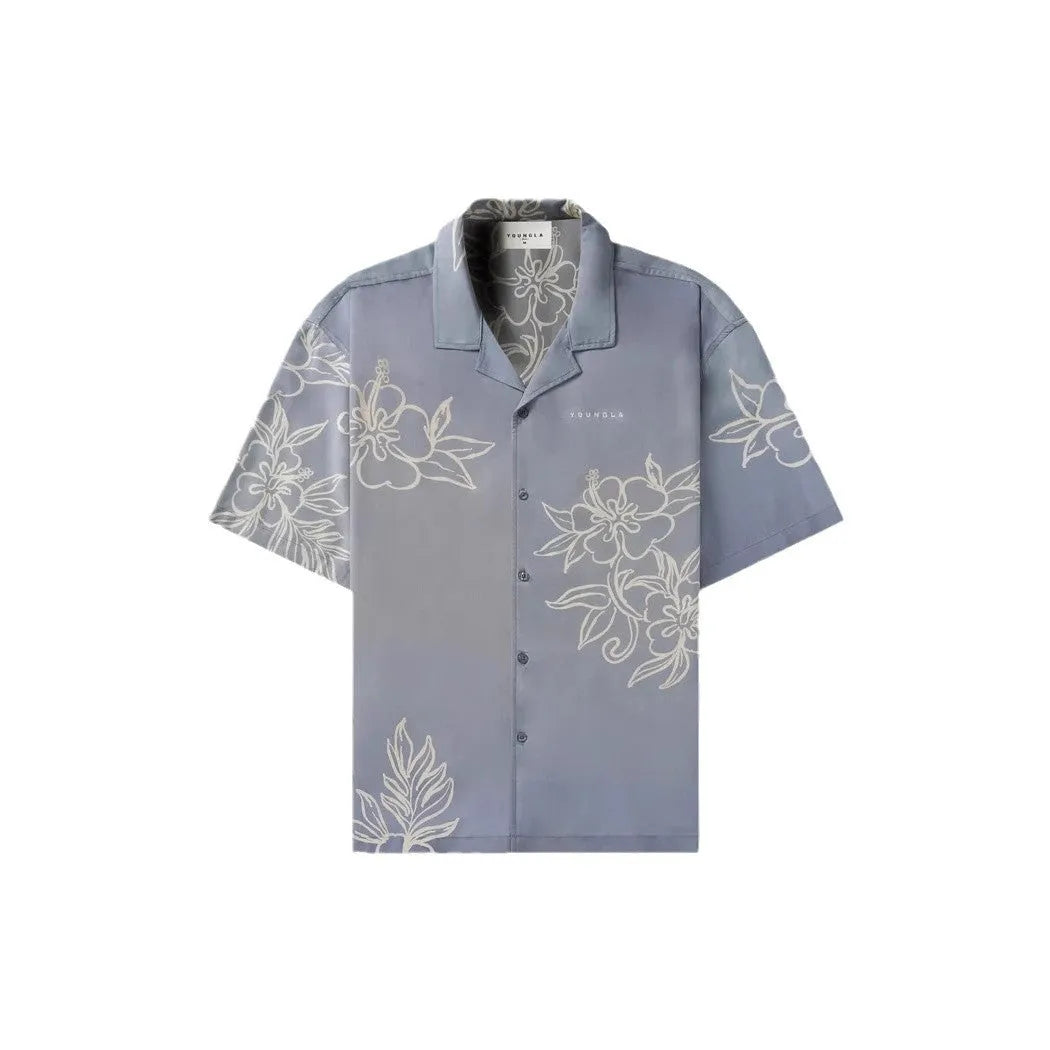 A loose-fitting short sleeve casual top with a floral print, shown in a light colour on a male model.