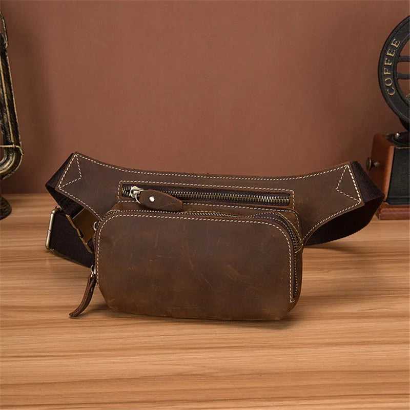 Brown cowhide leather men's sports waist bag with zip and internal phone pocket.