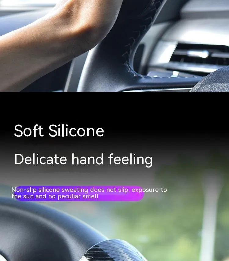 Black steering wheel assist ball with silicone grip surface shown on a car steering wheel
