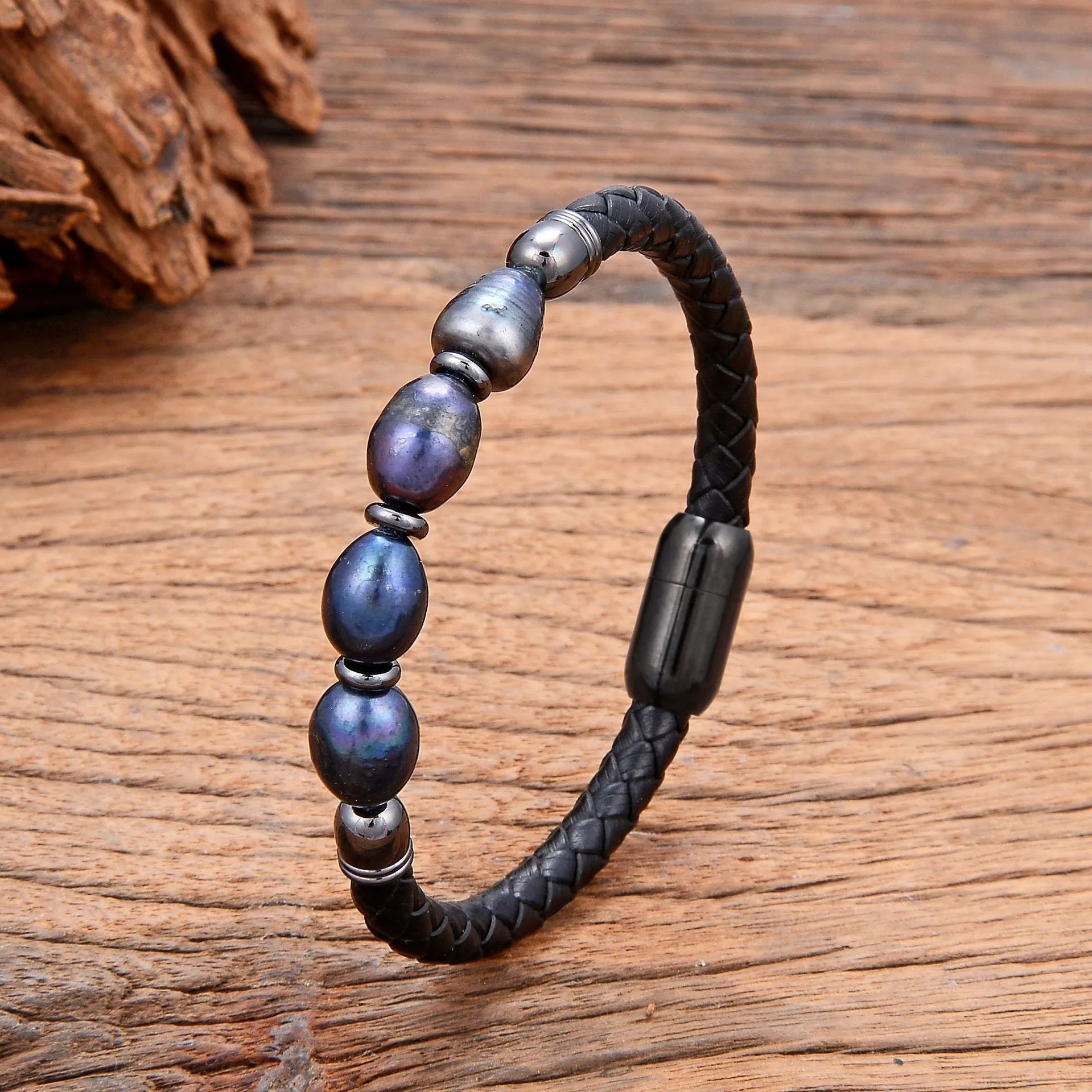 Handmade unisex bracelet with irregular pearls on adjustable leather strap in grey pearl and black.
