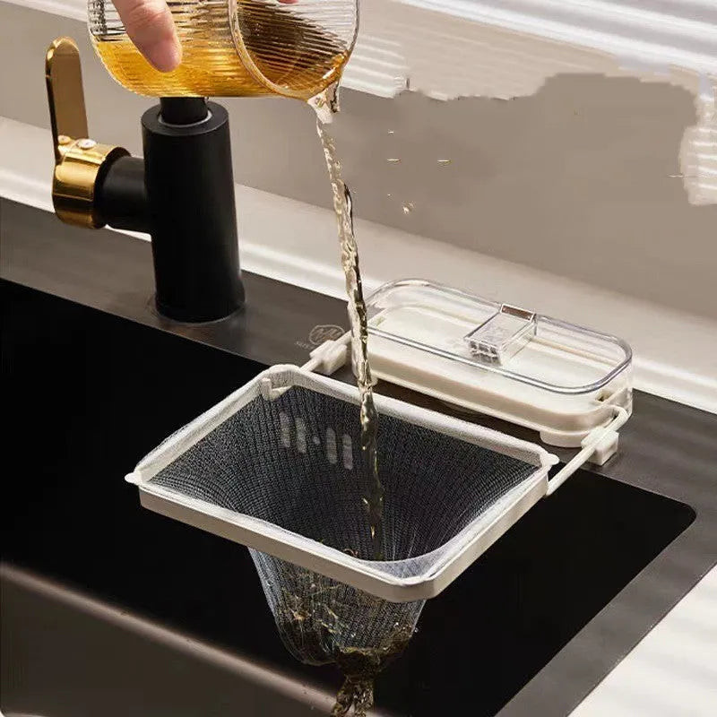 Dark green gold kitchen sink filter rack with suction cups and disposable mesh screen.