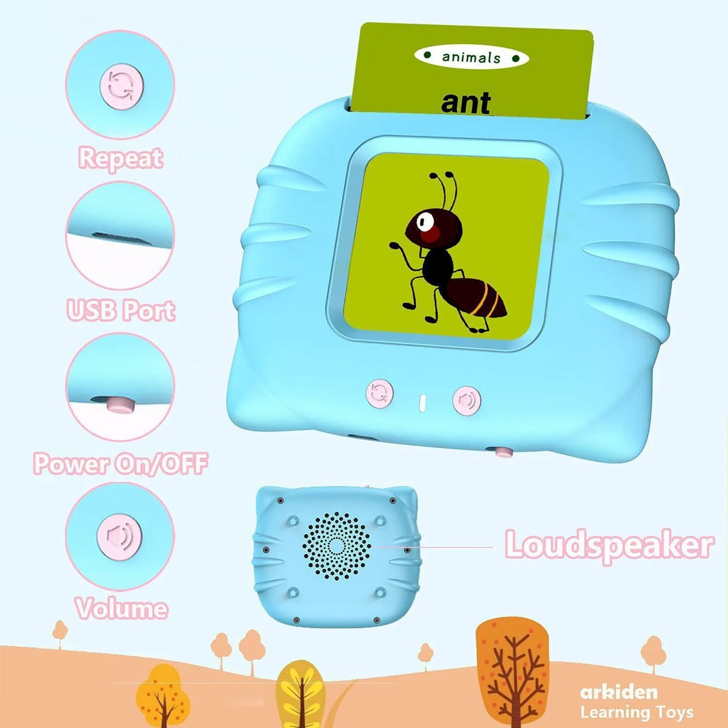 Blue children's learning machine with audio book cards on a table