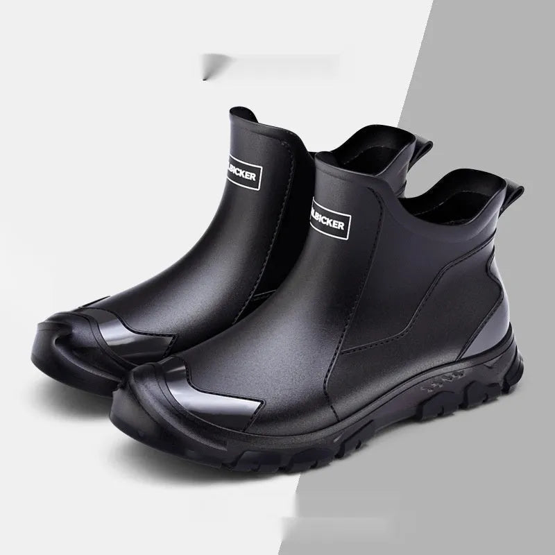 Low-cut short tube rubber rain boots in black with non-slip plastic soles.