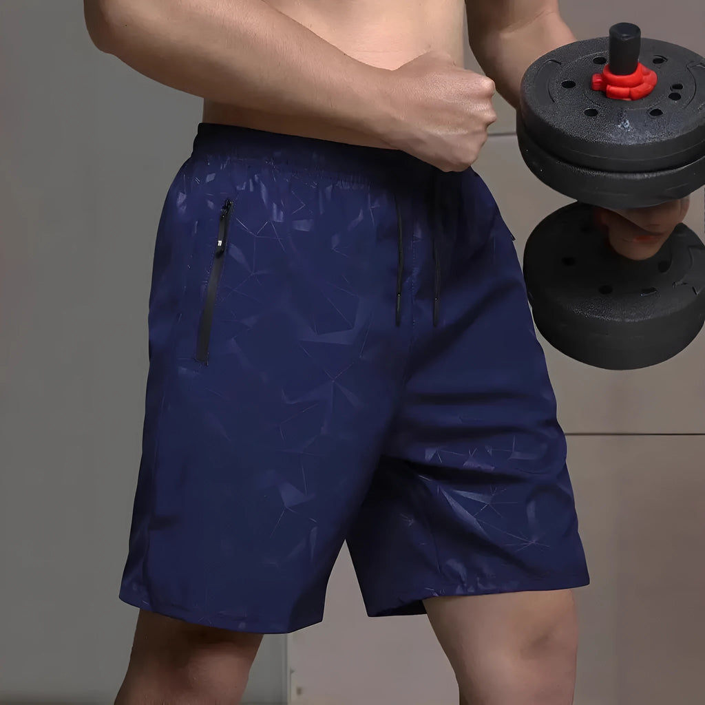 Men's loose-fit polyester sports shorts in blue colour showing elastic waistband and standard length cut