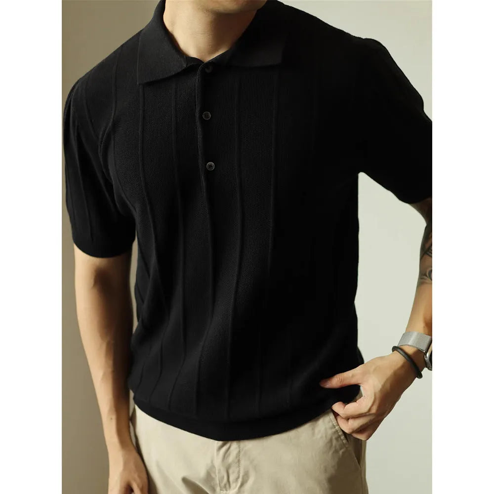 A man's loose-fit solid colour polyester pullover t-shirt on a hanger, shown in black and white colour options.