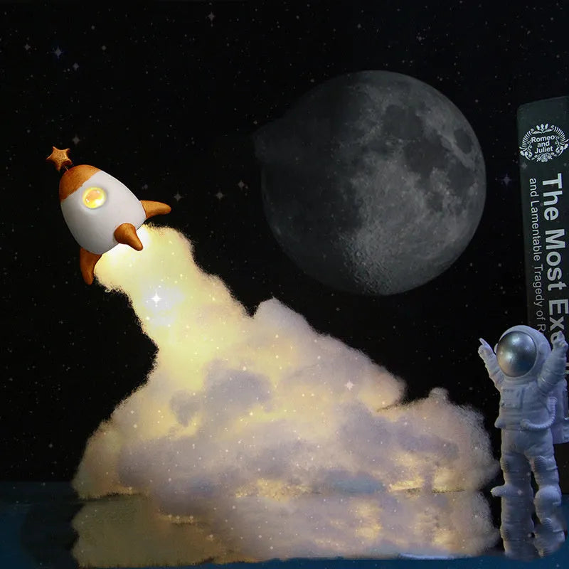 DIY astronaut rocket night light kit components including rocket model, LED string lights, chassis and assembly materials