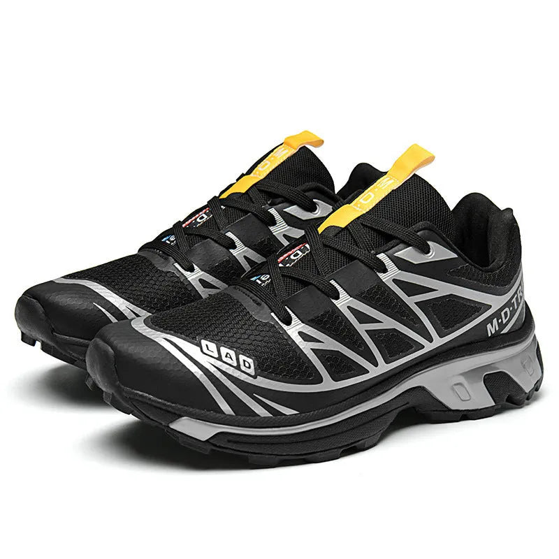 Low-top lace-up hiking shoes in artificial leather with a rubber sole and mesh lining.