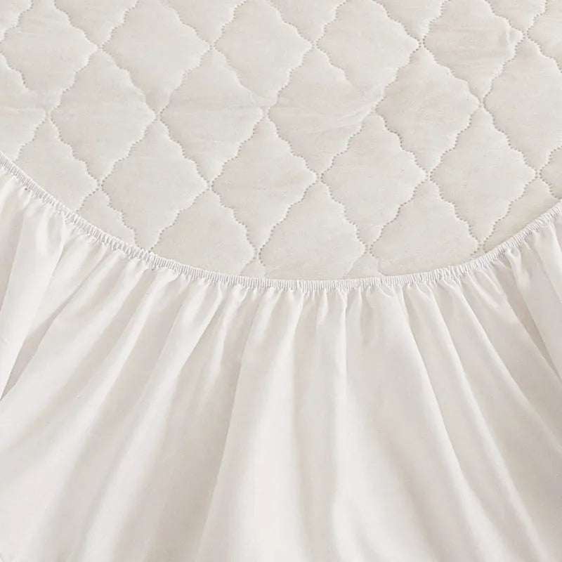 Diamond lattice quilted waterproof mattress protector fitted sheet set in solid colour.