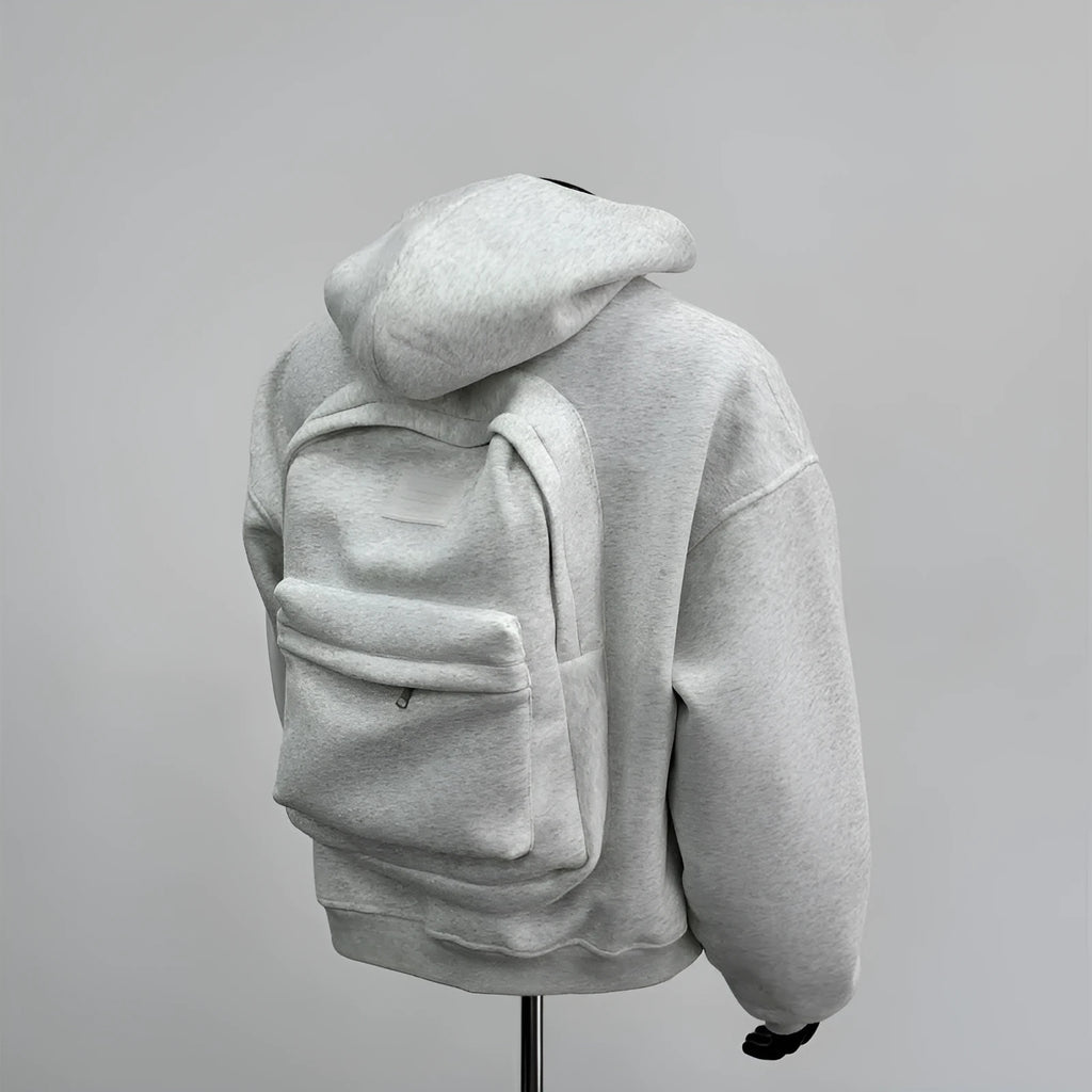 Light grey men's hoodie with backpack-style design on back, featuring a hood.