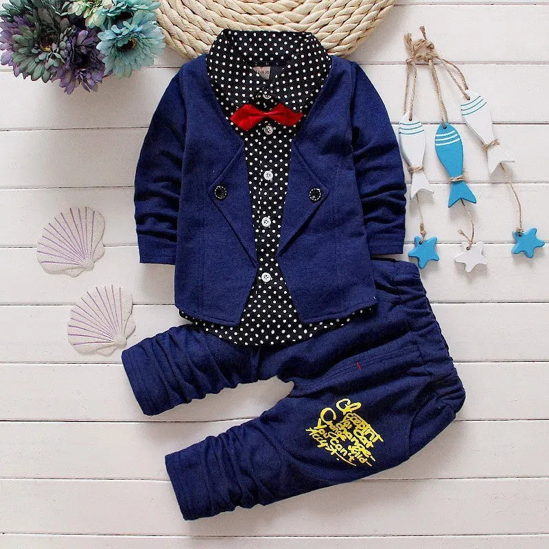 Casual blue kids sport suit consisting of a short-sleeved top and long trousers on a child mannequin.