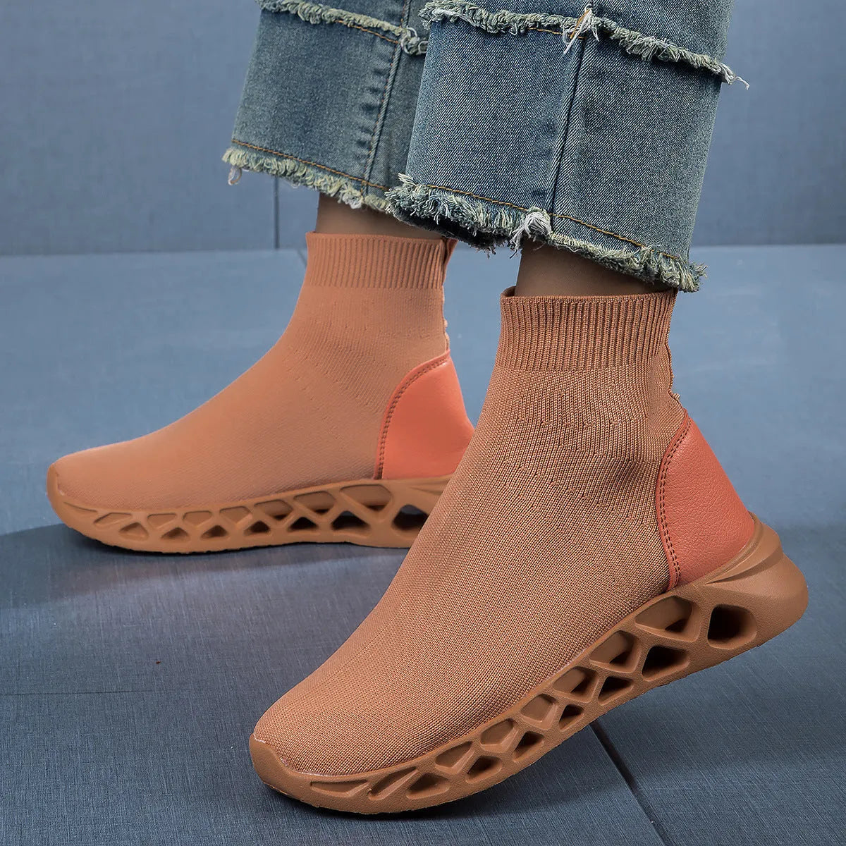 Women's low-top casual mesh slip-on shoe in terracotta colour on a white background.