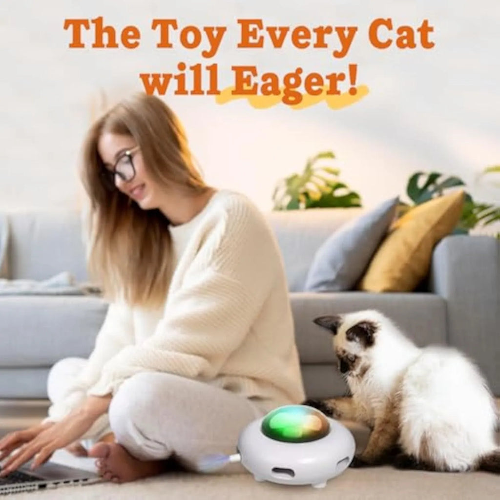 White automatic interactive cat toy with colourful feathers and LED lights on a floor.