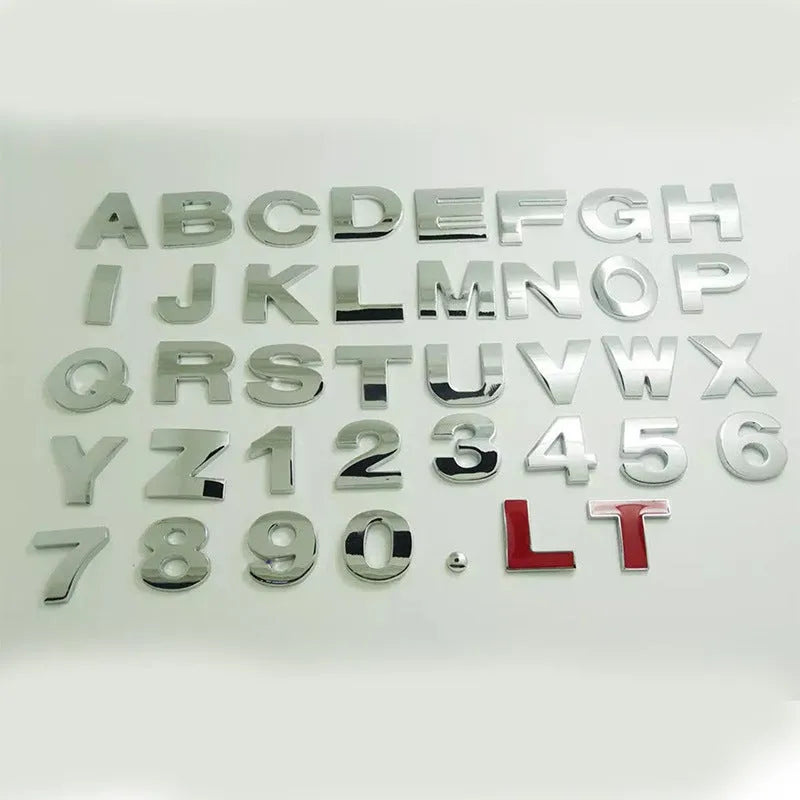 3D metal zinc alloy car letter sticker in black or silver, shown actual size at 2.5cm.
