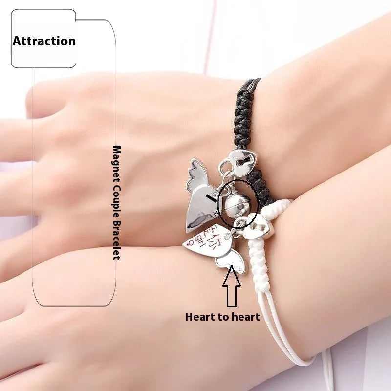 Couple suction bracelet pair showing electroplated alloy construction with crown pendant design