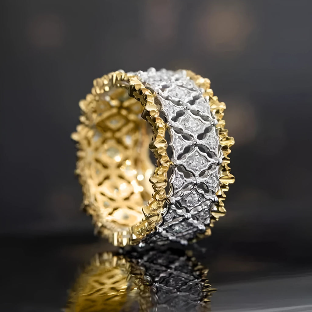 Geometric two-tone zircon copper ring showing electroplated finish and round stone elements.