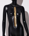 Arrow-shaped metal sequin bow tie with an electroplated finish in silver, black, or gold.