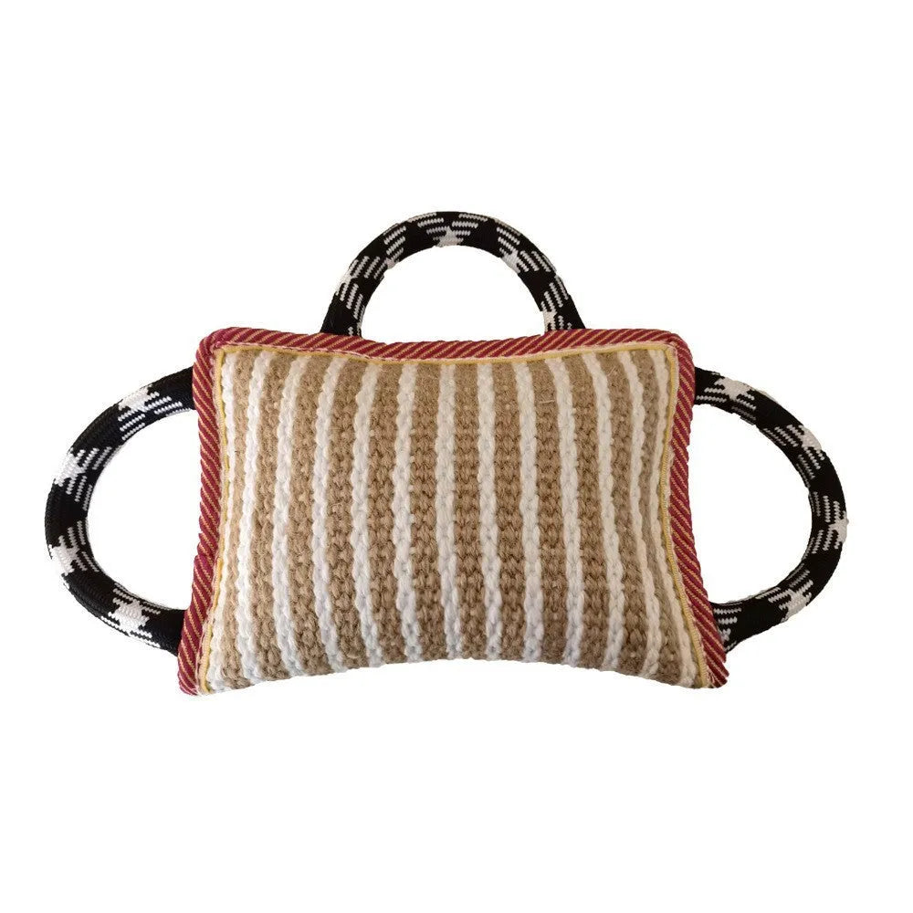 Blue dog tug toy with jute bite pillow and three rope handles for tug of war.