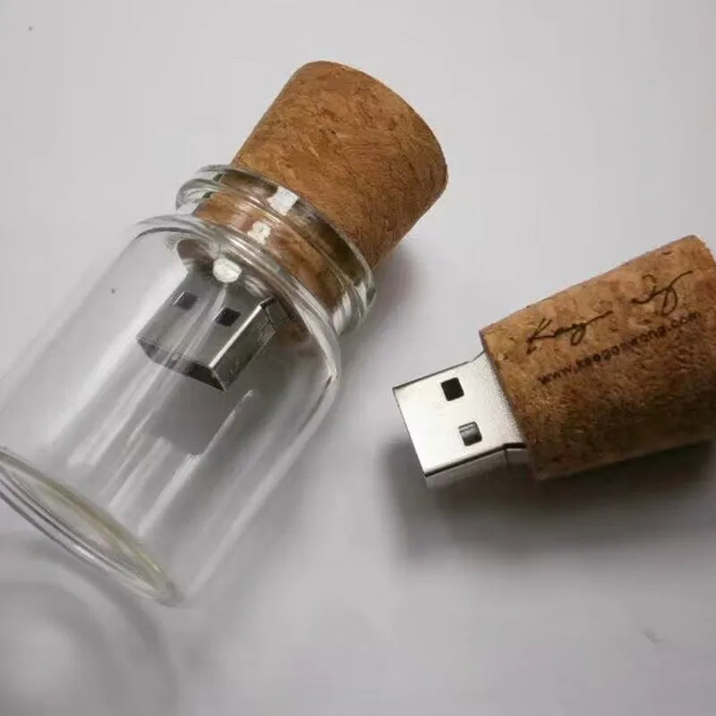 Transparent wooden wish drift bottle containing a USB flash drive on a white background.