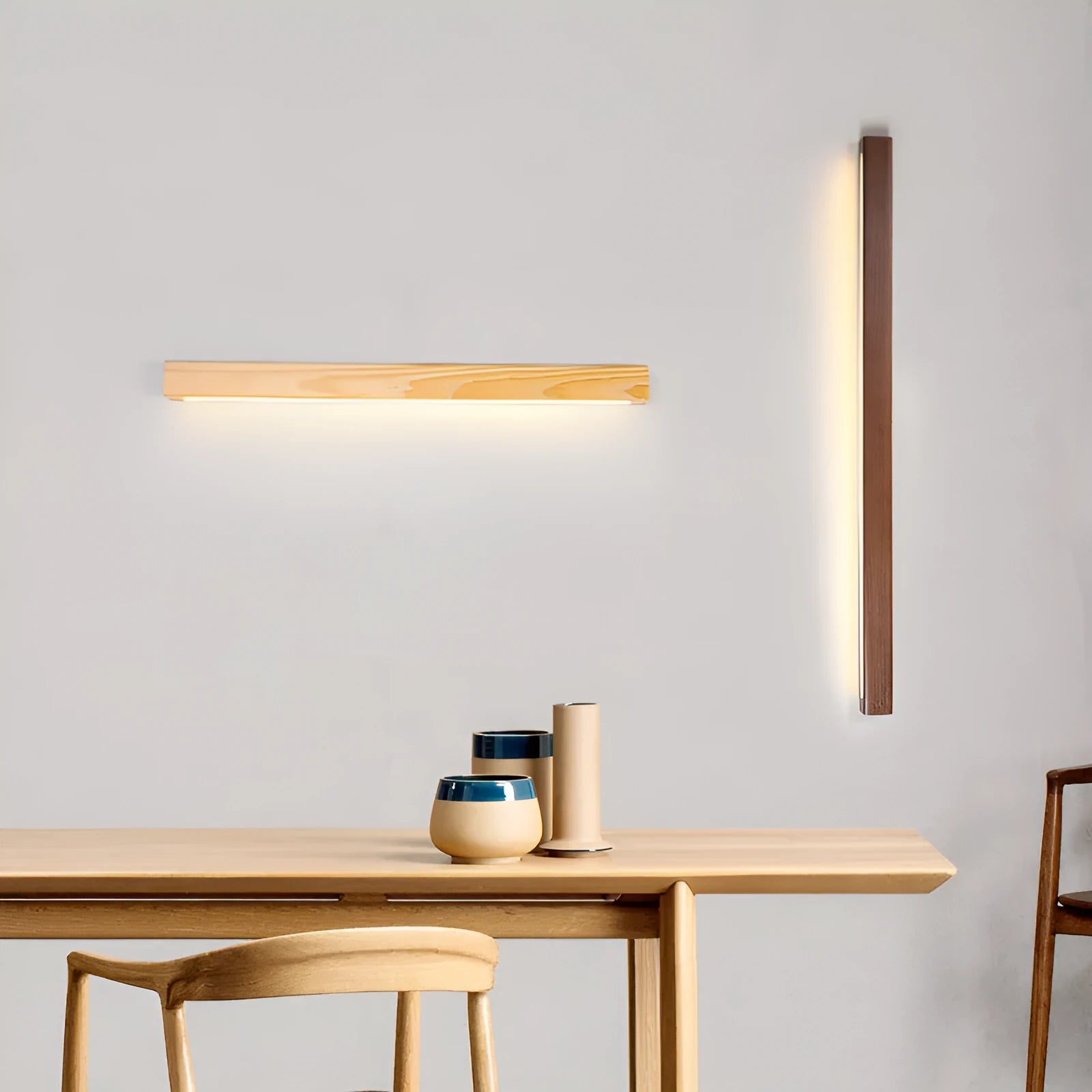 Walnut-coloured wooden log strip LED wall lamp with acrylic diffuser in minimalist design.