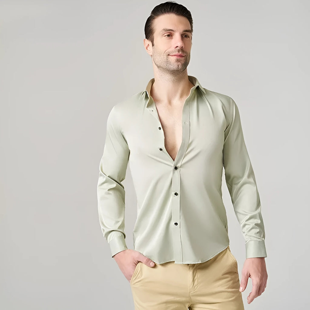 Man wearing a grey stretch long sleeve polyester work shirt, showing fit and collar detail.