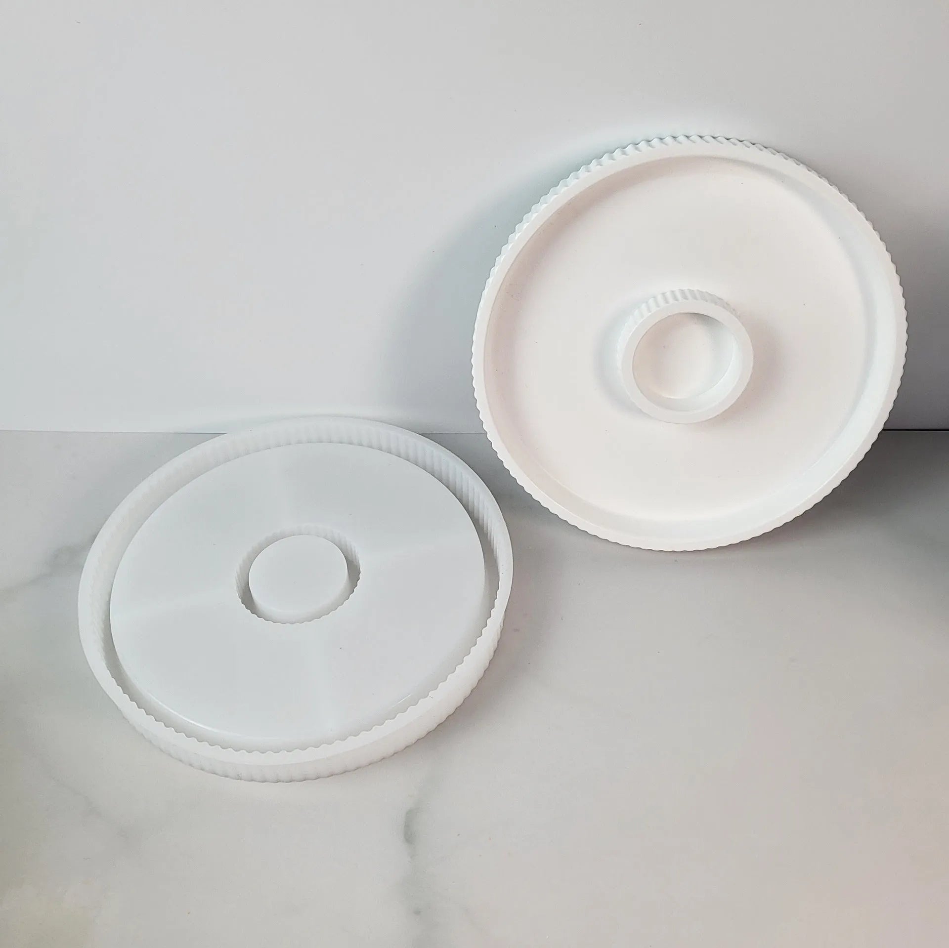 Set of five silicone baking moulds including tray, candlestick, and base shapes