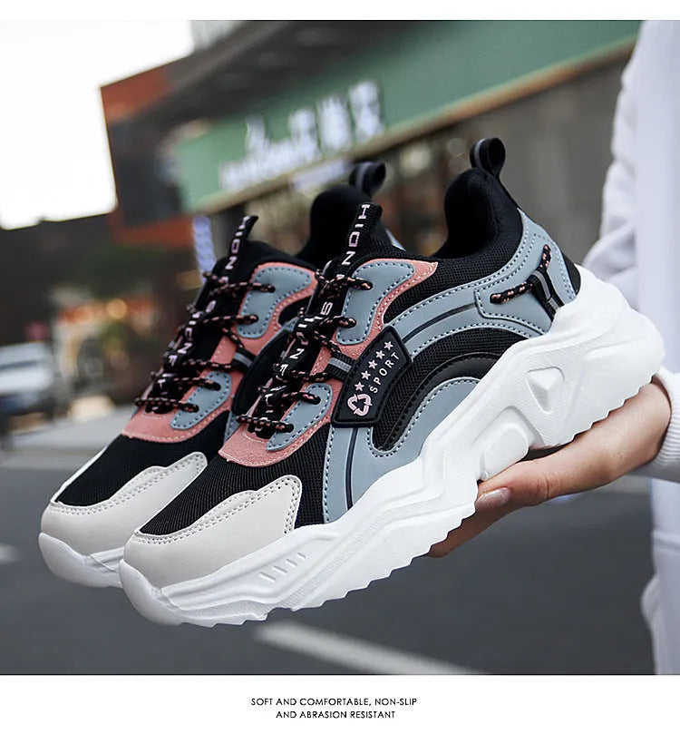 Women's white and black mesh casual sports shoes with thick sole, buckle closure, and round toe.