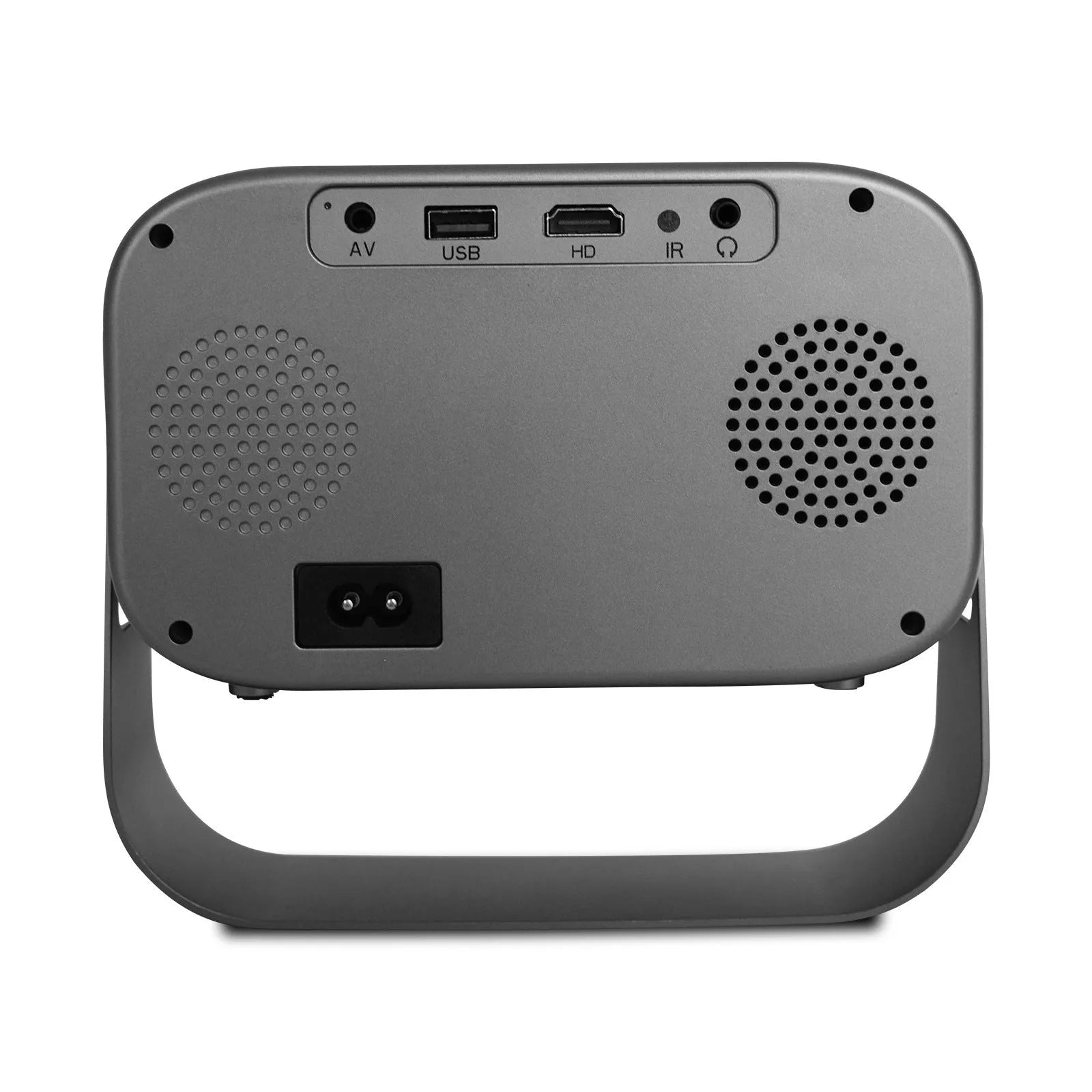 Black compact HD smart portable projector with remote control on a table.