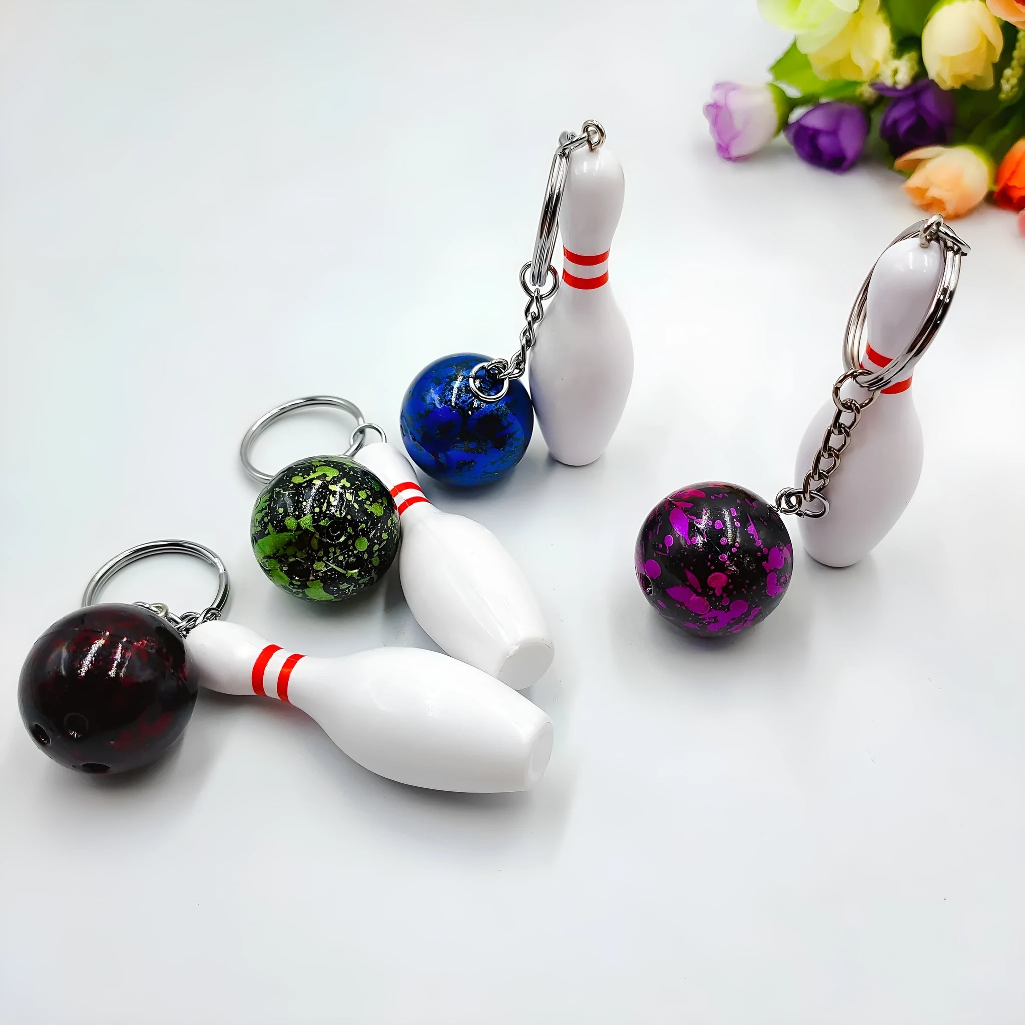 Mini bowling ball keychain pendant in dark red, blue, purple, or green colours